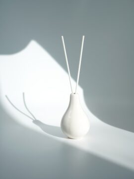 white ceramic vase with white flower, cajuput oil uses for diffuser, agarwood essential oil supplier, agarwood oil uses for what, agarwood oil uses for spiritual